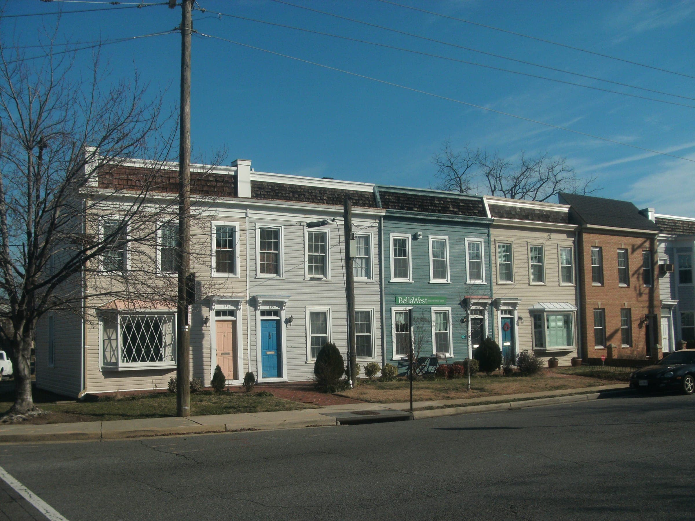 A row of painted townhouses in the North End of Alexandria, Virginia