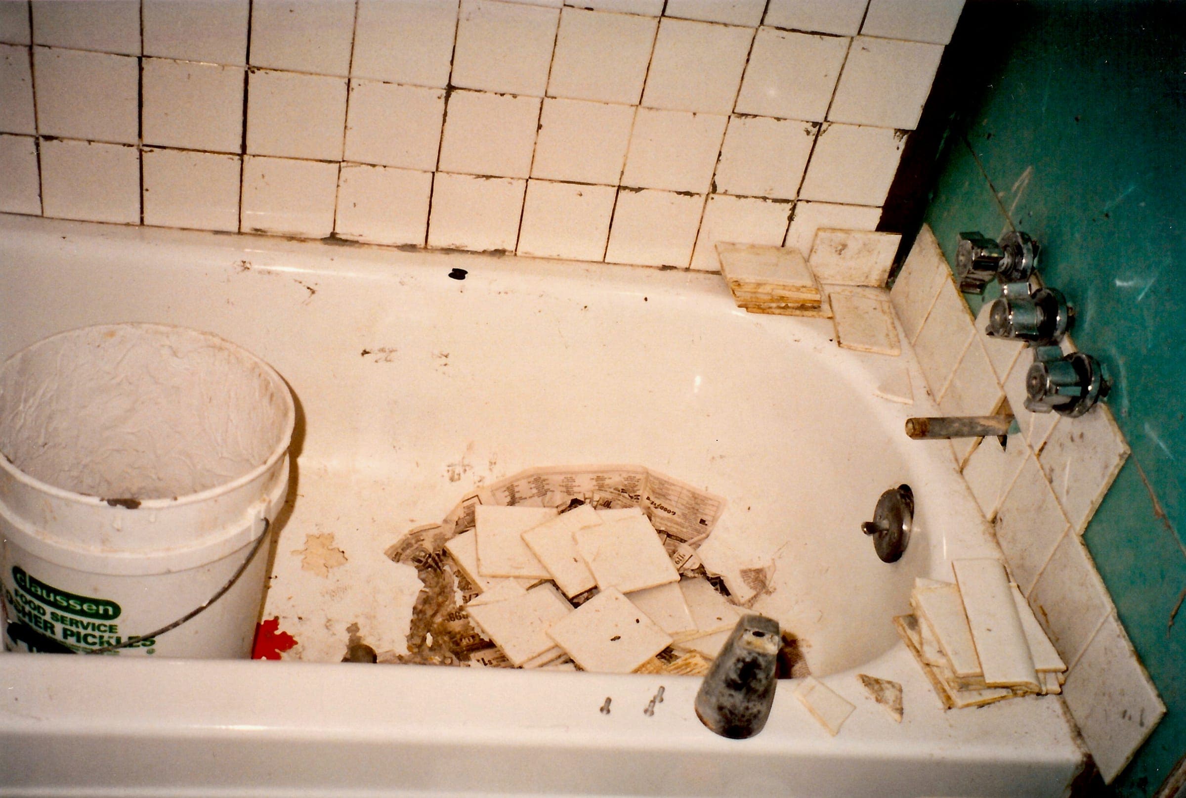 A bathtub surround stripped of old tile, ready to be retiled